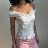Blouse Diandra à manches bouffantes en dentelle française